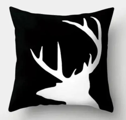 A black square throw pillow with a white deer head looking left on it.