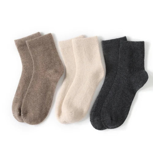 This 100% cashmere trio sock comes in brown, off-white and black