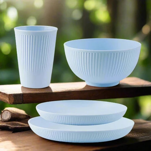 A light blue wheat straw dinnerware set. The set includes one large plate, one small plate, one bowl and one cup.