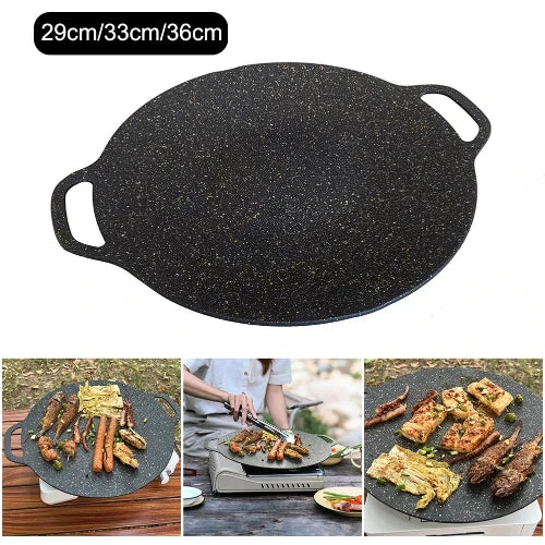 A black speckled griddle/grill pan with handles on either side. The pan is shown in three images below: empty, with meat and vegetables cooking, and with cooked food. The text above reads 29cm/33cm/36cm.