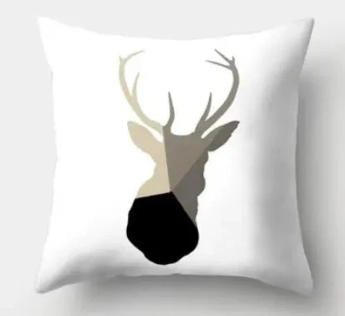 A white square throw pillow with a geometric deer head design.