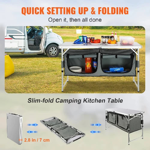 A portable table for outdoors is set up at a campsite. The table has a large aluminum countertop and two side organizers with shelves. A white van is parked in the background. Text on the image reads: "QUICK SET  UP & FOLDING. Open it, then all done. Slim-fold Camping Kitchen Table 2.8in / 7cm." Folded dimensions are shown.