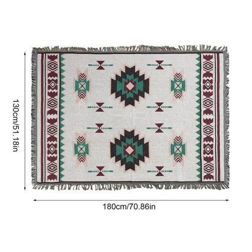 A white blanket with a southwestern style design in teal, red and black with its dimensions. The dimensions are 130cm/51.18in wide and 180cm/70.86in long.