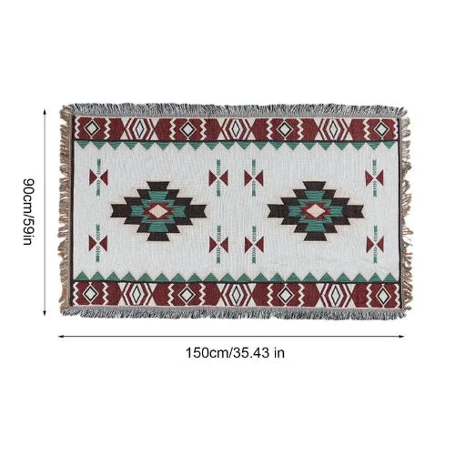 A white blanket with a southwestern style design in teal, red and black with its dimensions. The dimensions are 90cm/35.43in wide and 150cm/59in long.