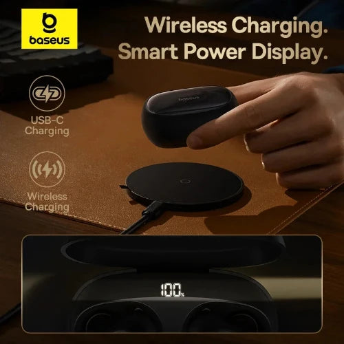 A hand placing a black wireless earbud charging case on a wireless charging pad. The text on the image reads "Baseus", "Wireless Charging", "Smart Power Display", and "USB-C Charging".